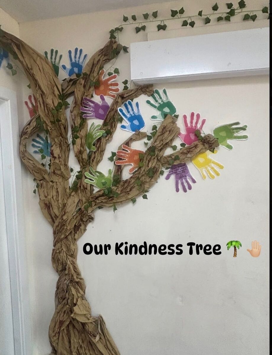 Our Kindness Tree wall display with children’s handprints